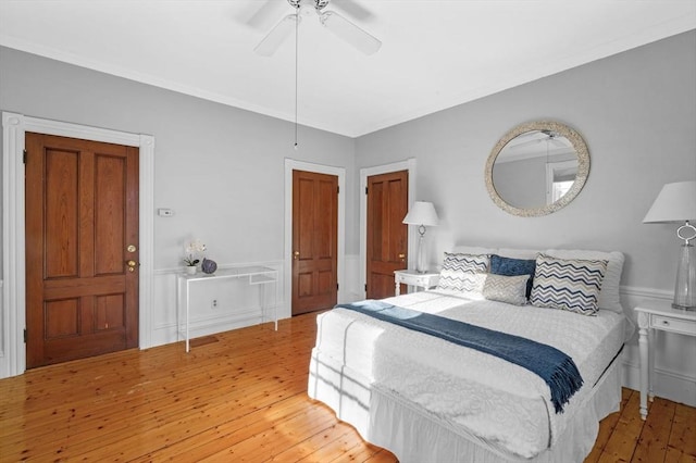 bedroom featuring hardwood / wood-style flooring and ceiling fan