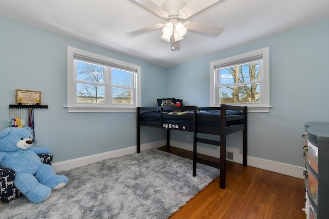 bedroom featuring ceiling fan and hardwood / wood-style floors