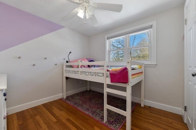 bedroom with ceiling fan and hardwood / wood-style floors