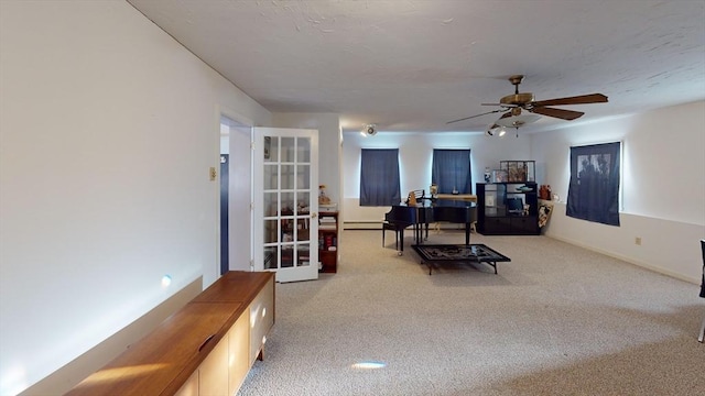 office space with ceiling fan and carpet