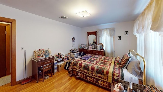 bedroom with light hardwood / wood-style flooring