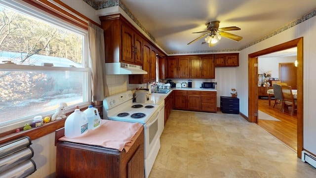 kitchen with black microwave, sink, ceiling fan, and white range with electric stovetop