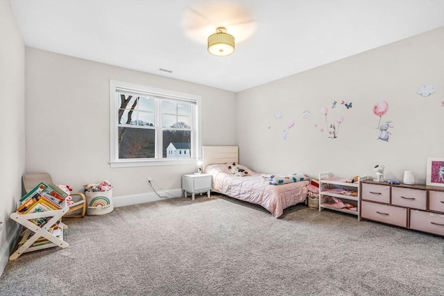 bedroom featuring carpet floors and baseboards