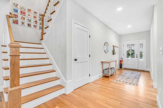 entryway featuring stairs, baseboards, wood finished floors, and recessed lighting