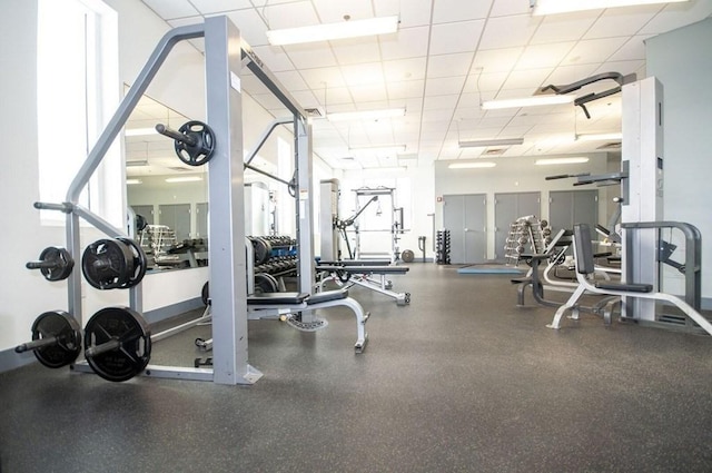 workout area featuring a paneled ceiling