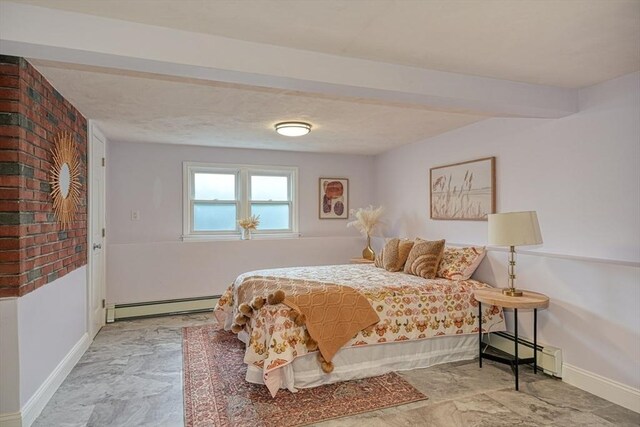 bedroom featuring baseboards and a baseboard radiator