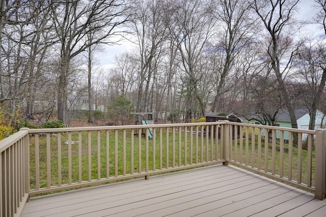 wooden terrace with a yard