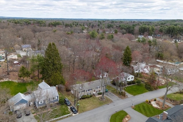 drone / aerial view with a forest view and a residential view