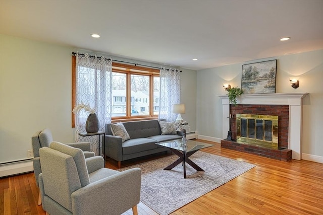 living area with recessed lighting and wood finished floors