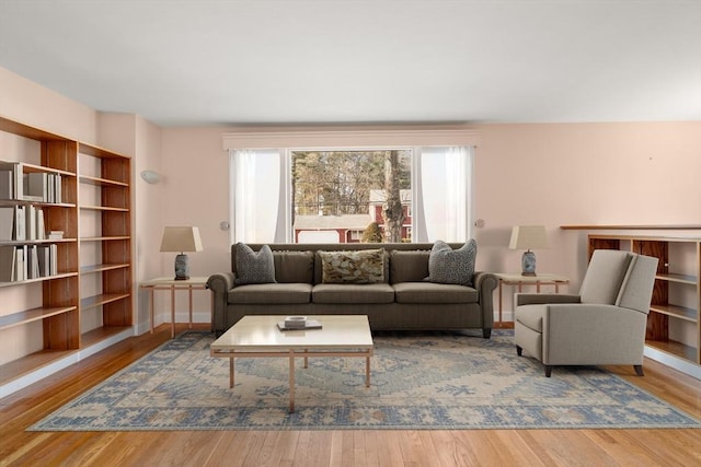 living room with wood finished floors and baseboards