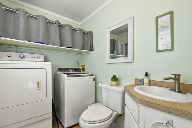 full bathroom with washing machine and clothes dryer, toilet, crown molding, and vanity