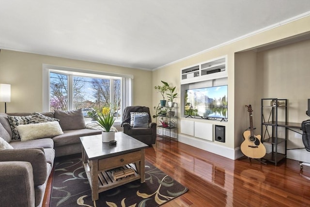 living room featuring ornamental molding and wood finished floors