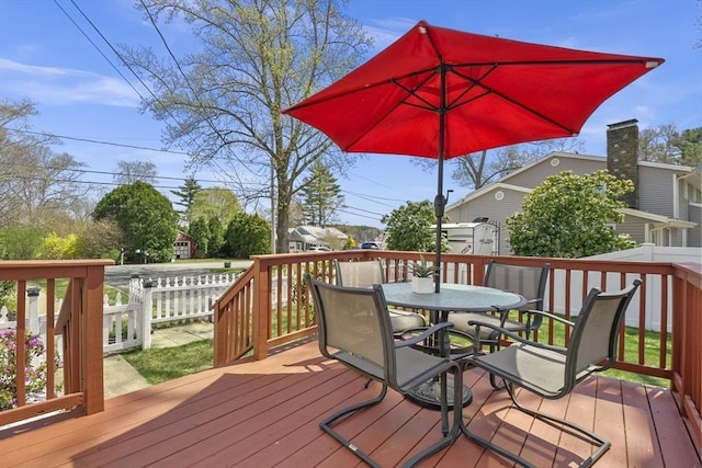 deck with outdoor dining space