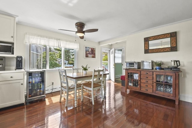 dining room with crown molding, beverage cooler, ceiling fan, dark wood-style floors, and a baseboard radiator