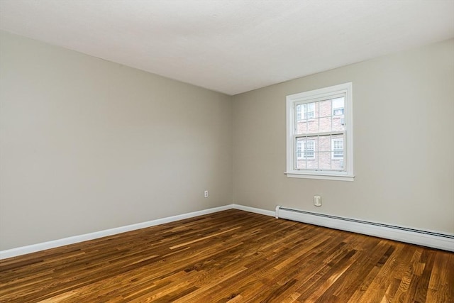 30 Danbury Dr Unit 8, Methuen, MA 01844 - spare room with dark wood-type flooring and a baseboard heating unit