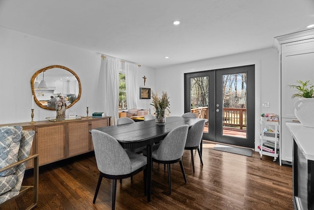 dining room with recessed lighting, wood finished floors, and french doors