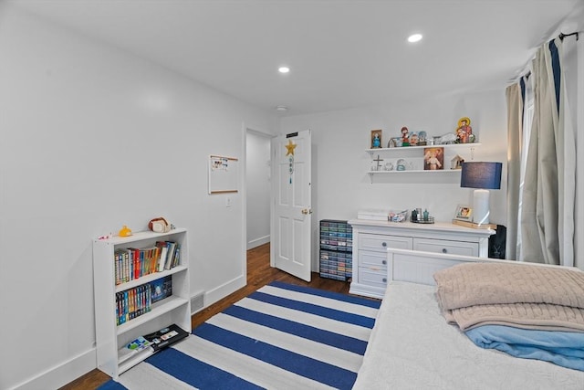 bedroom featuring recessed lighting, visible vents, baseboards, and wood finished floors