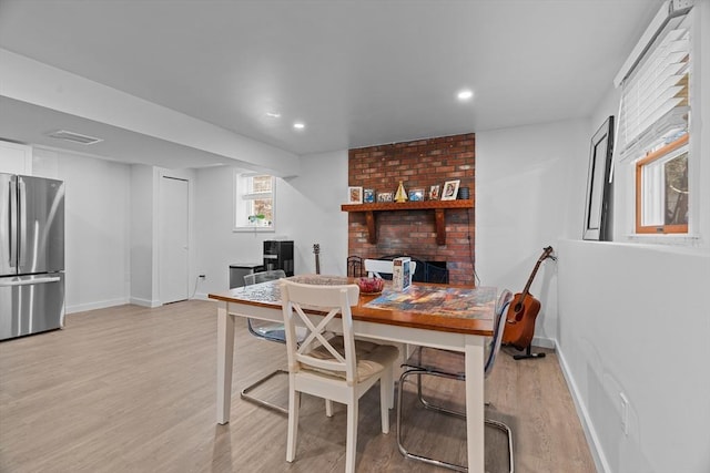 dining space featuring recessed lighting, baseboards, and light wood finished floors