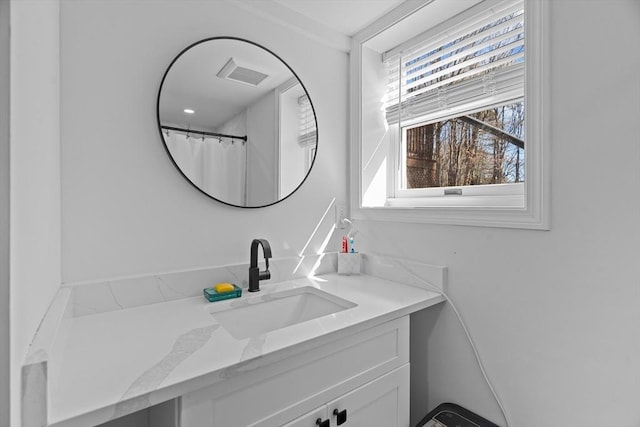 full bath with visible vents and vanity