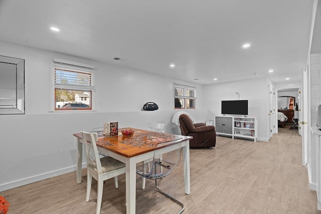 dining space with recessed lighting, visible vents, light wood-type flooring, and a healthy amount of sunlight