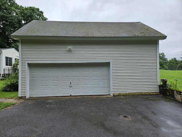 garage with aphalt driveway