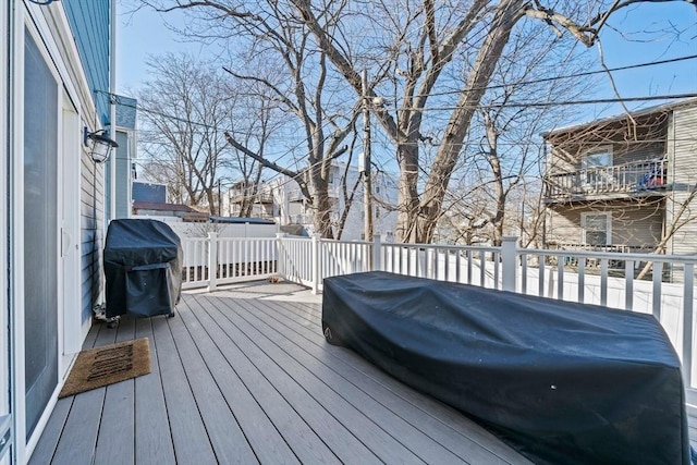 wooden deck featuring area for grilling