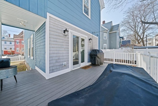 wooden terrace with grilling area and fence