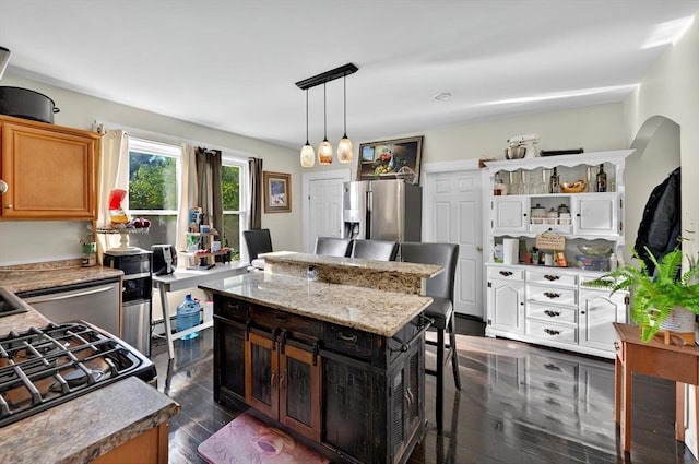 166 Beattie St Unit 2, Fall River, MA 02723 - kitchen with stainless steel fridge with ice dispenser, a center island, open shelves, dark wood-type flooring, and gas range oven