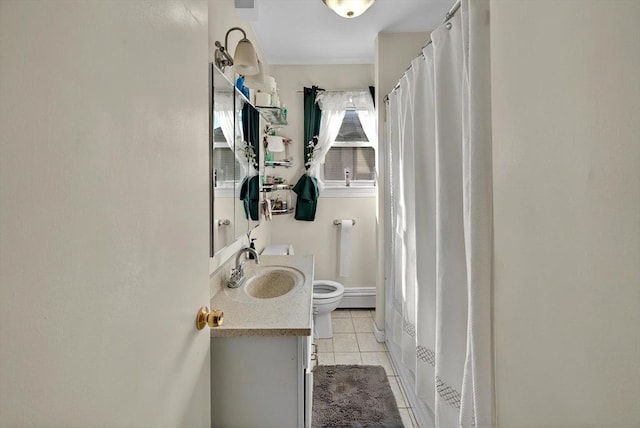 166 Beattie St Unit 2, Fall River, MA 02723 - bathroom featuring toilet, vanity, tile patterned flooring, baseboard heating, and a shower with shower curtain