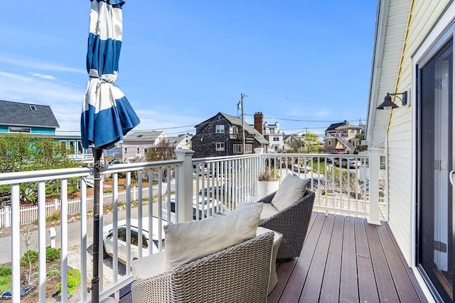 wooden terrace with a residential view