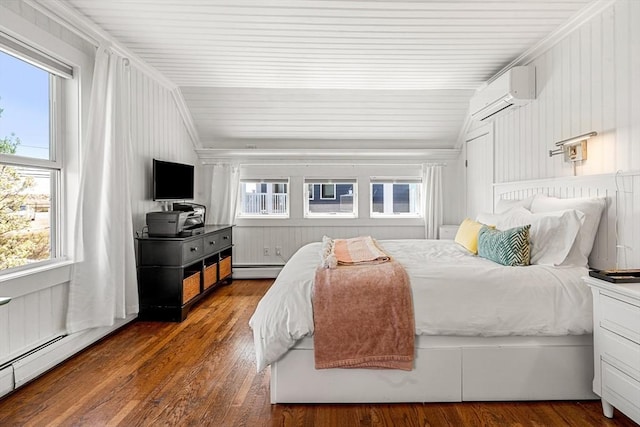 bedroom featuring a baseboard radiator, multiple windows, and vaulted ceiling