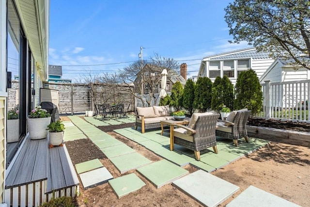 view of patio featuring a fenced backyard and outdoor lounge area