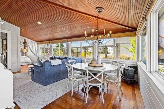 sunroom with wood-type flooring, wood ceiling, a notable chandelier, and vaulted ceiling