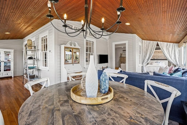 dining room featuring an inviting chandelier, wood ceiling, vaulted ceiling, and hardwood / wood-style flooring