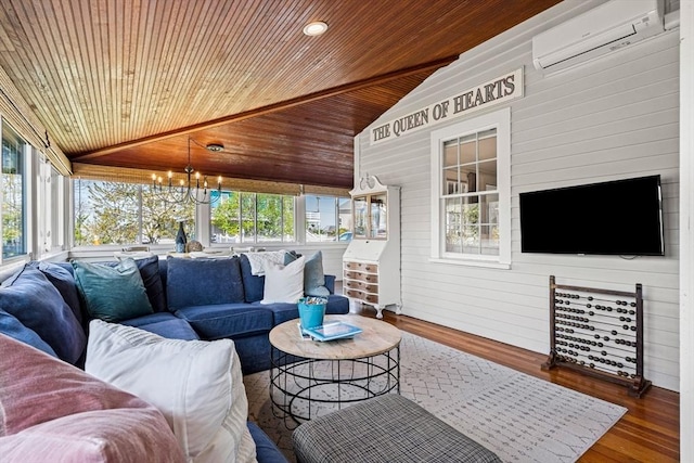 exterior space featuring an AC wall unit, a chandelier, and a healthy amount of sunlight