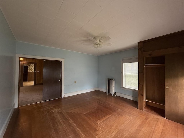unfurnished bedroom featuring ceiling fan and baseboards
