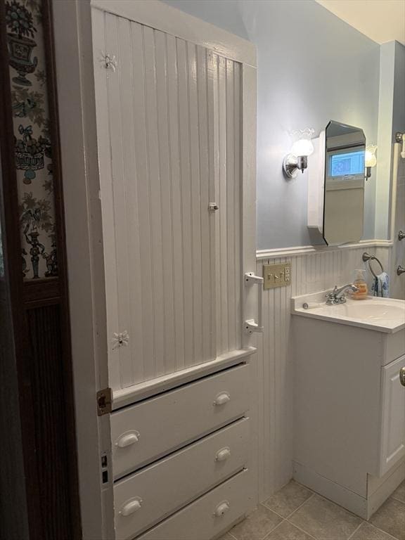 bathroom with tile patterned floors and vanity