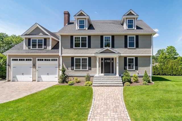 32 Charles St, Natick, MA 01760 - view of front of home with a chimney, a front lawn, driveway, and roof with shingles
