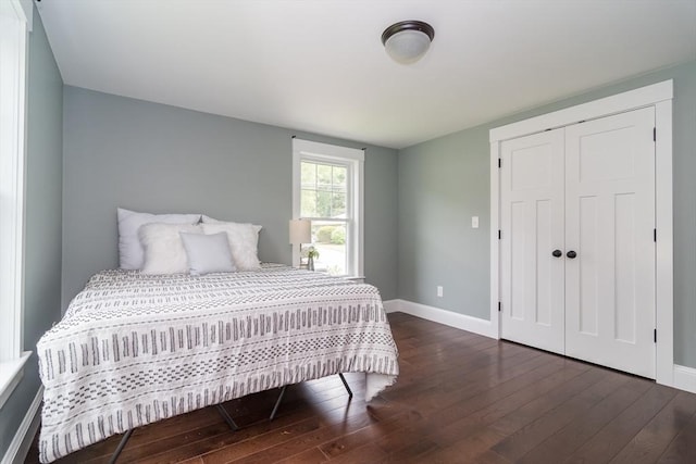 32 Charles St, Natick, MA 01760 - bedroom featuring wood-type flooring, baseboards, and a closet