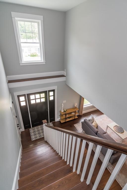 32 Charles St, Natick, MA 01760 - foyer entrance featuring wood finished floors and stairway