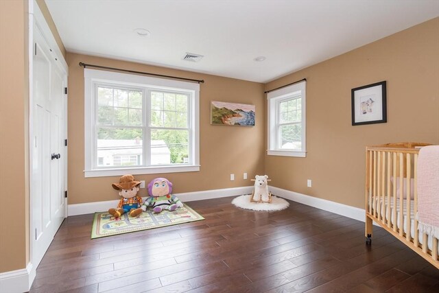 32 Charles St, Natick, MA 01760 - unfurnished bedroom with dark wood finished floors and baseboards
