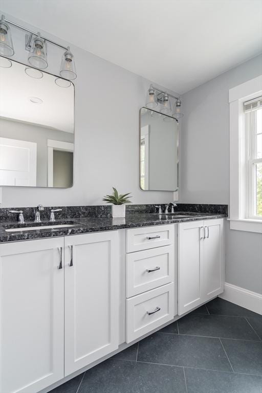 32 Charles St, Natick, MA 01760 - bathroom featuring double vanity, tile patterned flooring, and baseboards