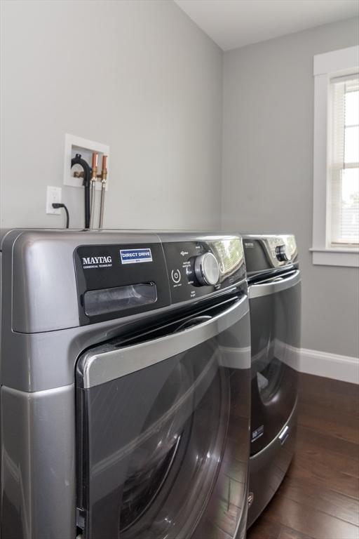 32 Charles St, Natick, MA 01760 - laundry room with washer and clothes dryer, dark wood-style floors, and baseboards