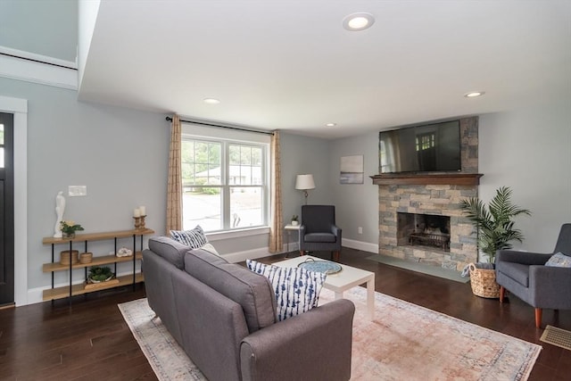 32 Charles St, Natick, MA 01760 - living area featuring a stone fireplace, wood finished floors, recessed lighting, and baseboards