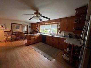 kitchen featuring stainless steel refrigerator, ceiling fan, and light hardwood / wood-style floors