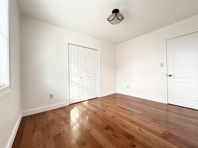 unfurnished bedroom featuring hardwood / wood-style floors