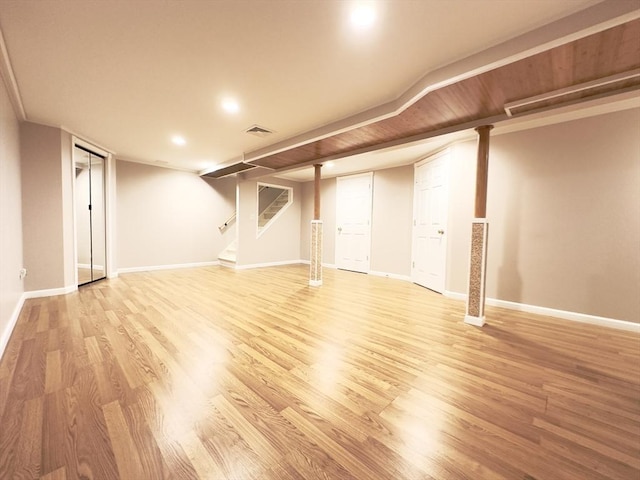 basement featuring light hardwood / wood-style flooring