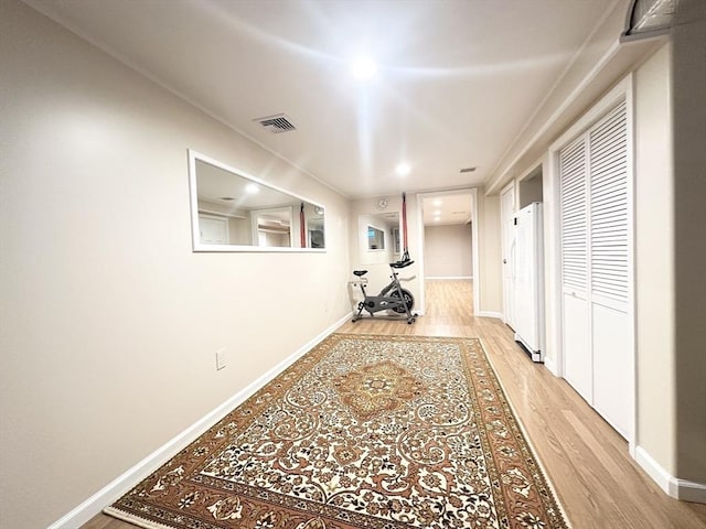 corridor with light wood-type flooring