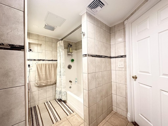 bathroom with shower / tub combo, tile patterned floors, tile walls, and ornamental molding