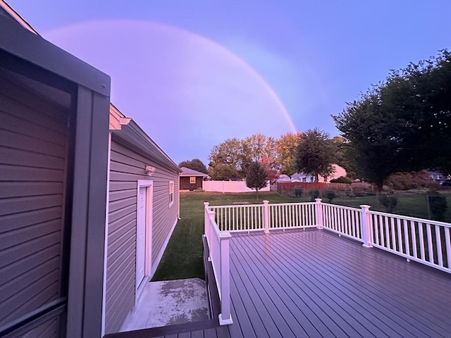 deck at dusk with a yard